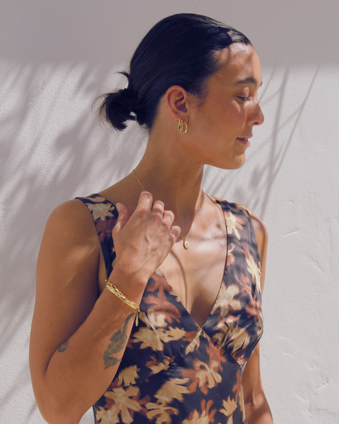 Woman wearing a floral dress 18 old Vermeil Jewellery