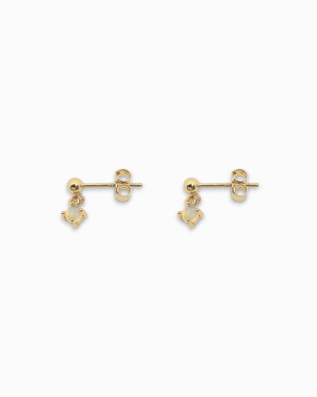 18k Gold Drop Studs with a holographic stone laying flat on a white background