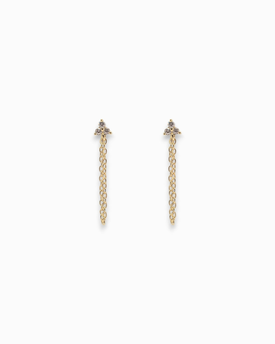 Pair of gold chain earrings with 3 tiny zirconia stones on a white background