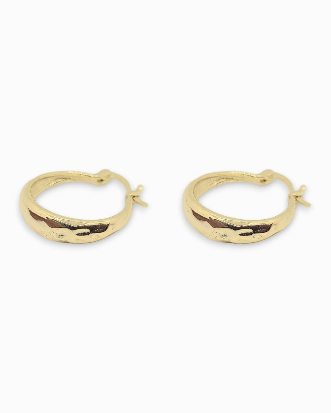 Gold hoop earrings with a slight hammerd texture on a white background