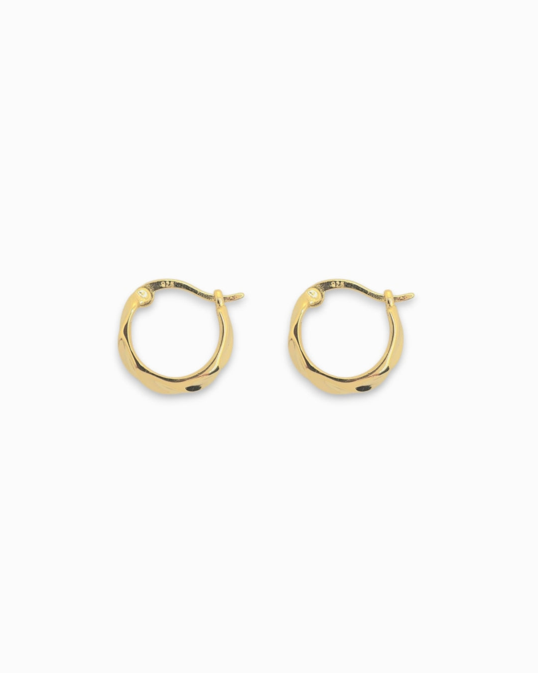 Small textured Gold hoop earrings on a white background