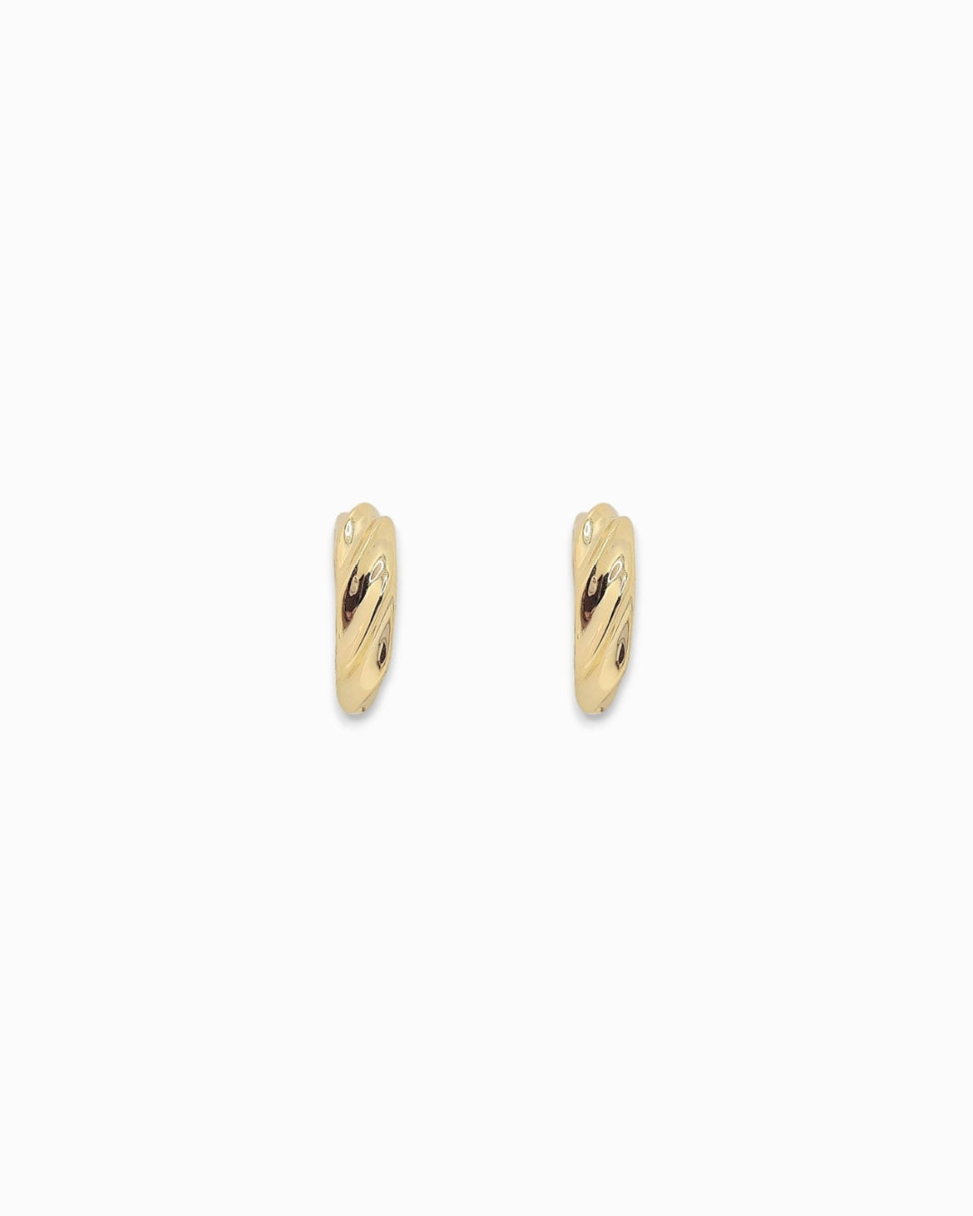 Gold hoop earrings with a textured twist on a white background