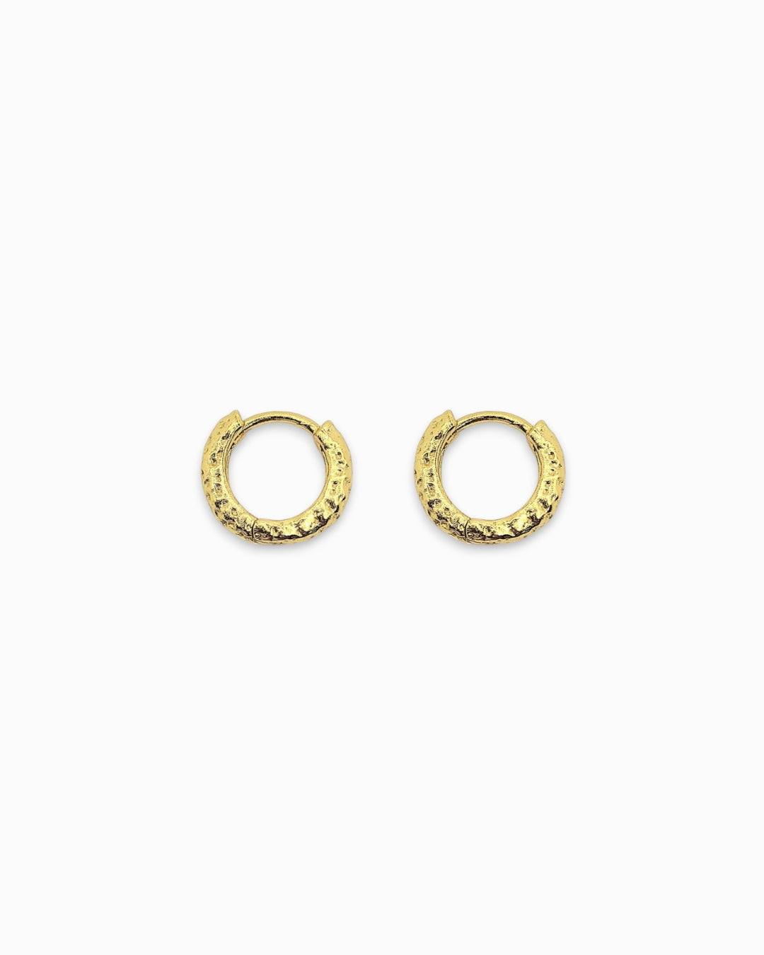 Hammered Gold huggie hoop earrings on a white background