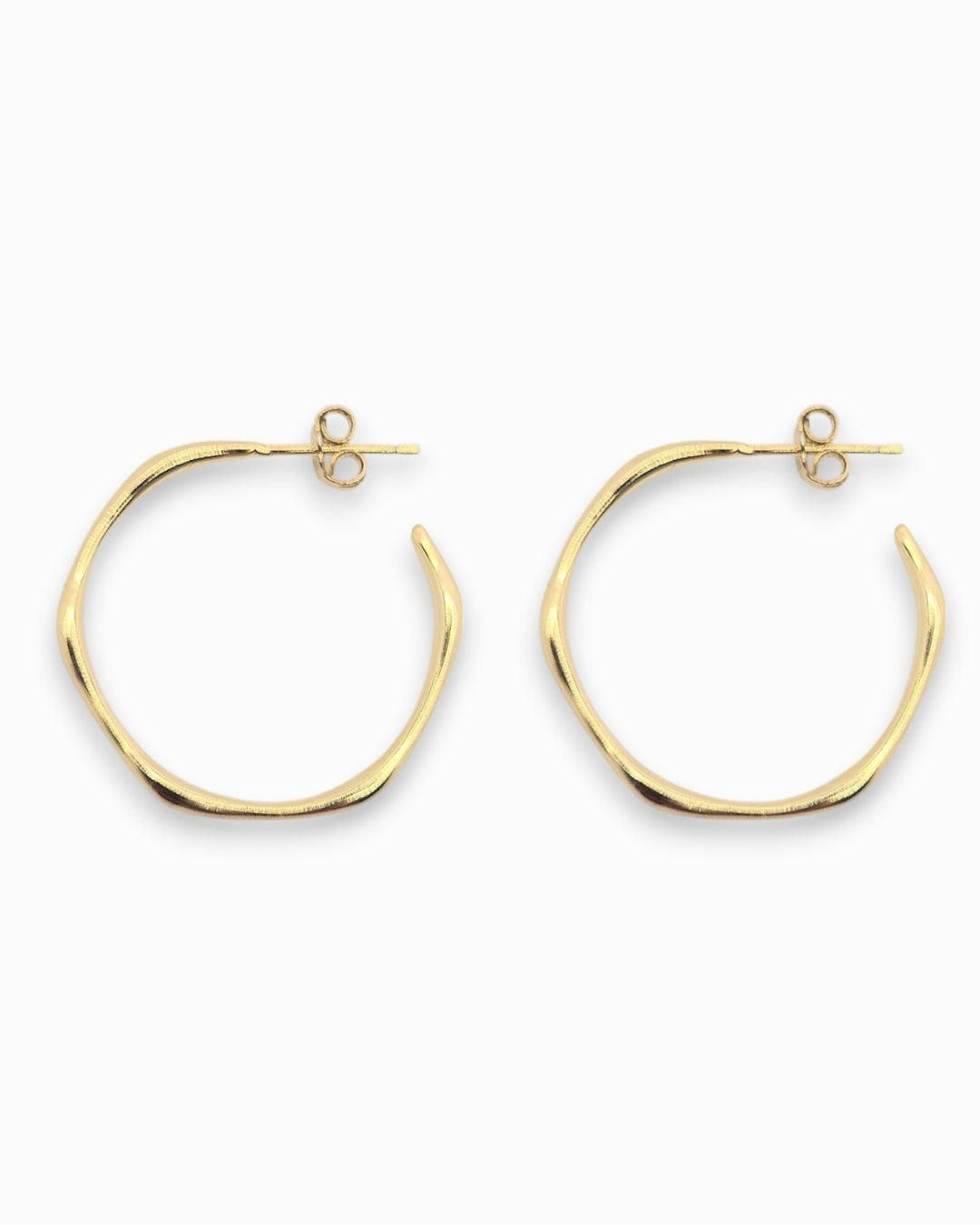 Large 18k Gold hoop earrings on a white background