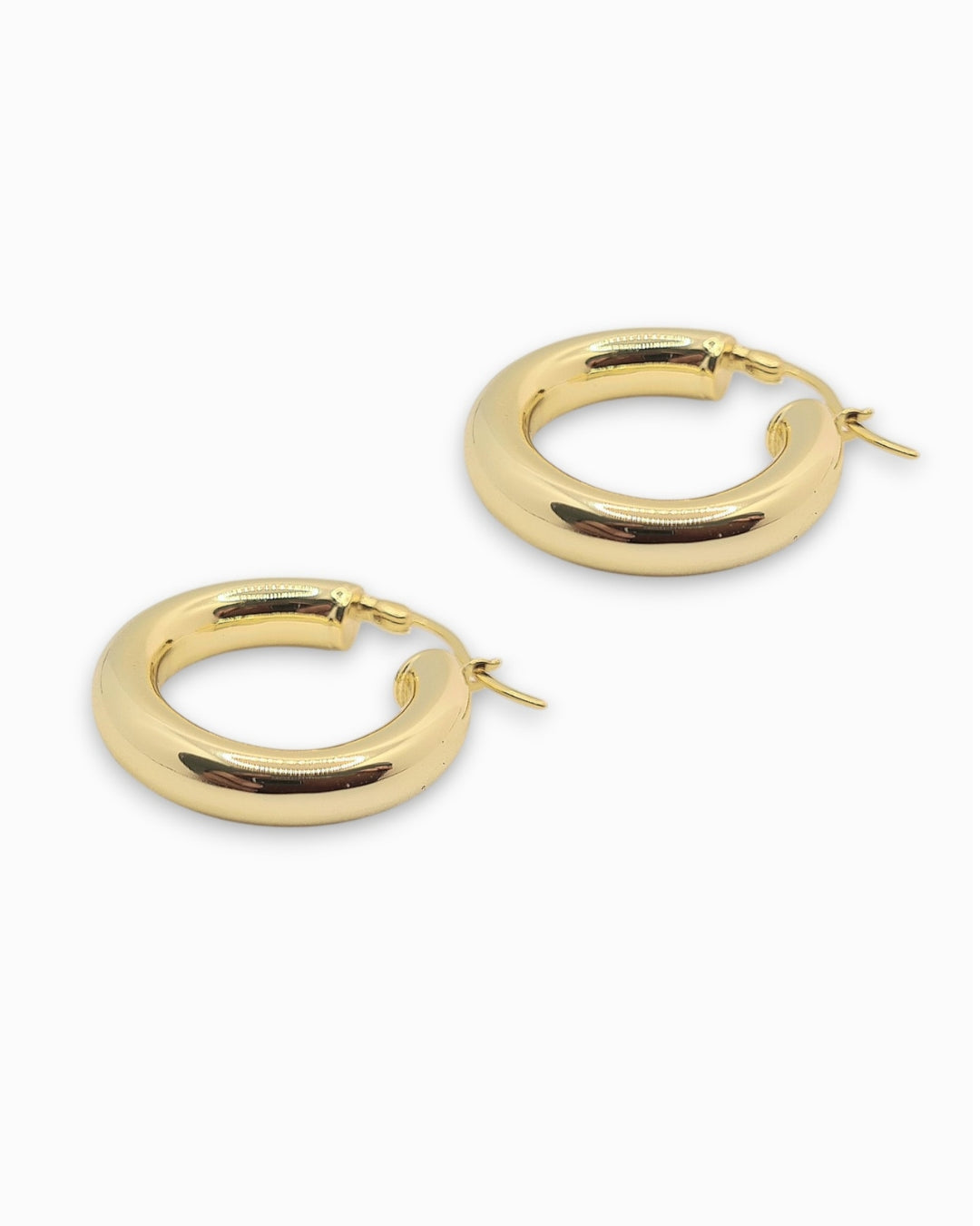 Chunky 18k Gold hoop earrings on a white background