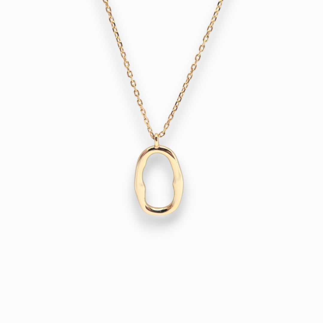 Gold necklace with a unique pendant on a white background