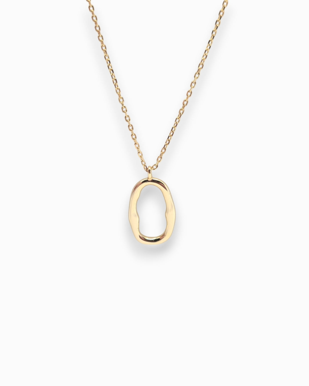 Gold necklace with a unique pendant on a white background