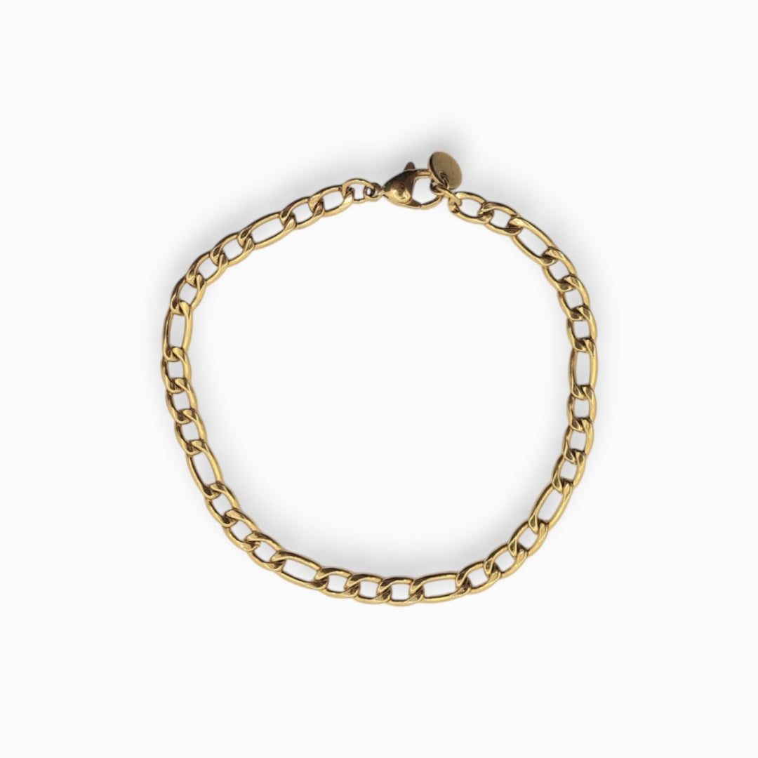 Gold Figaro chain bracelet on a white background