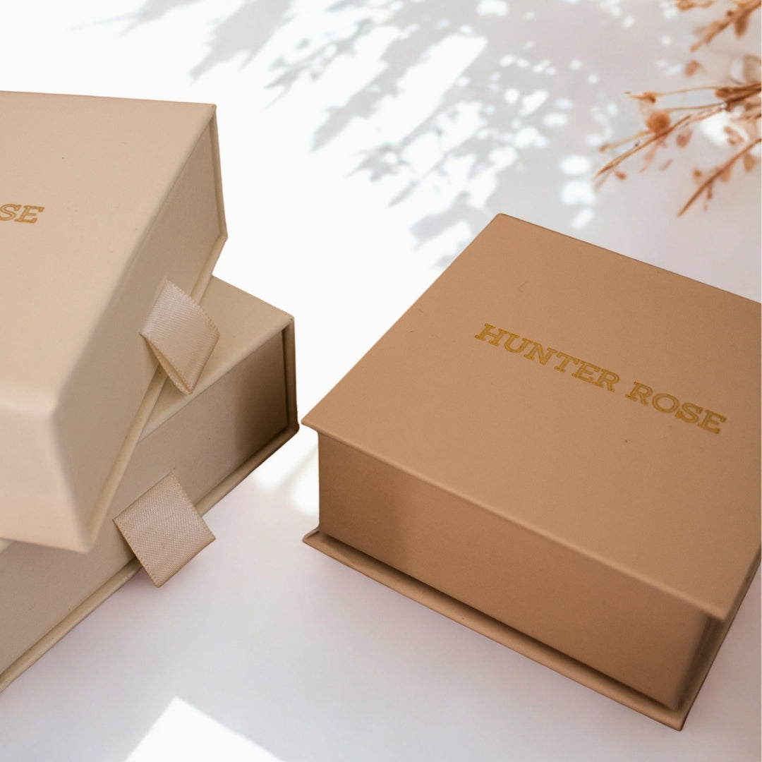 Two beige boxes with 'HUNTER ROSE' branding on a light background