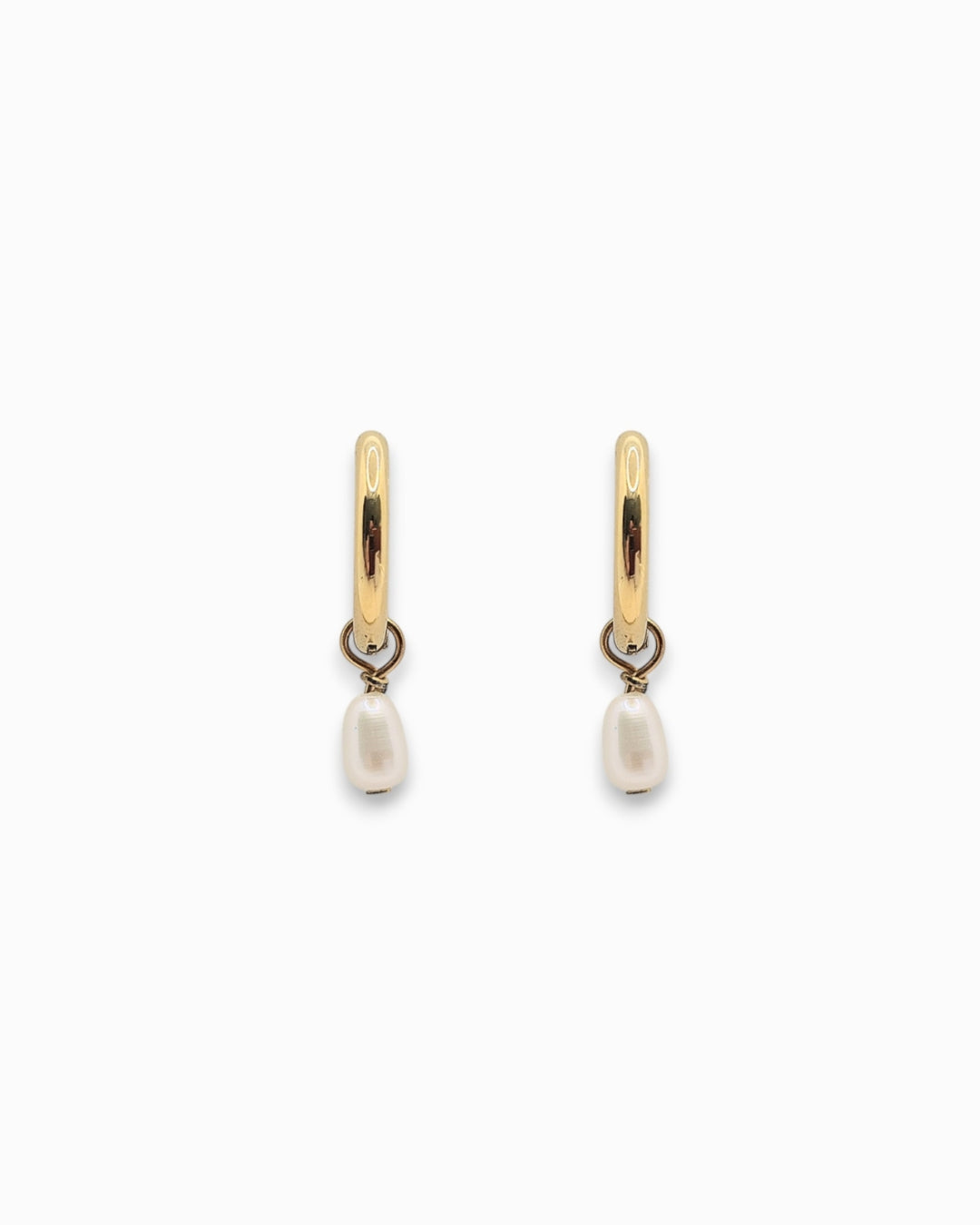 Gold hoop earrings with pearl drops on a white background