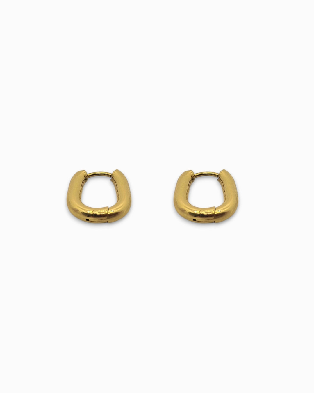 Gold hoop earrings on a white background