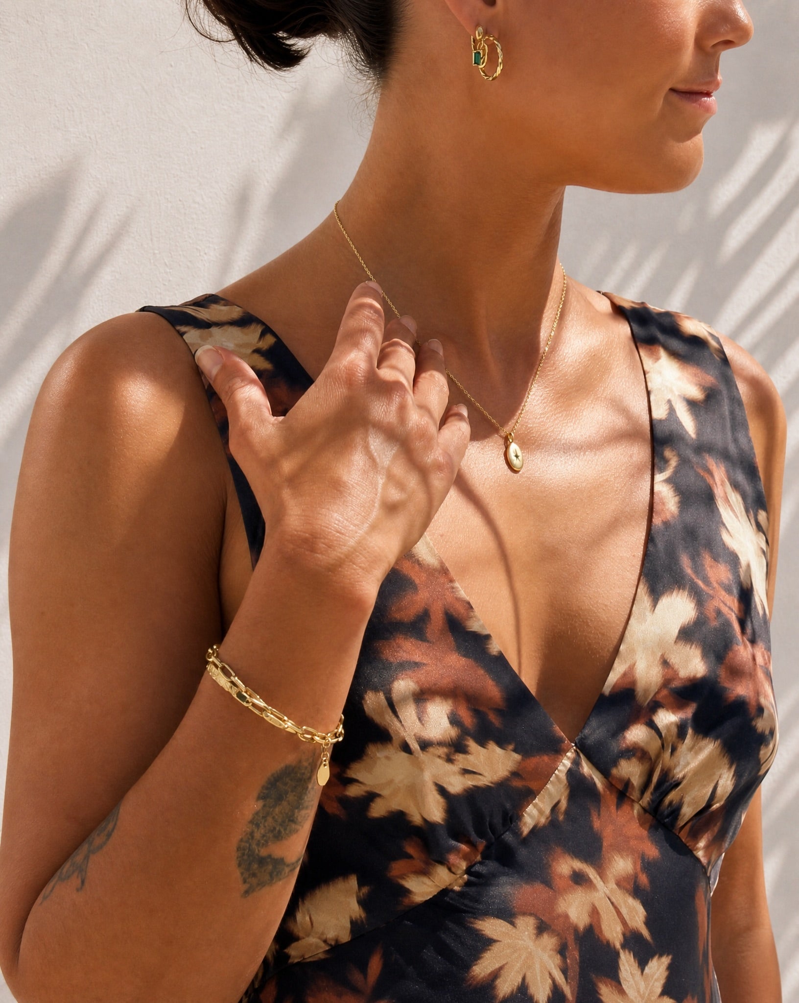 Lifestyle model wearing the Ava fine link gold plated jewellery by Hunter Rose.