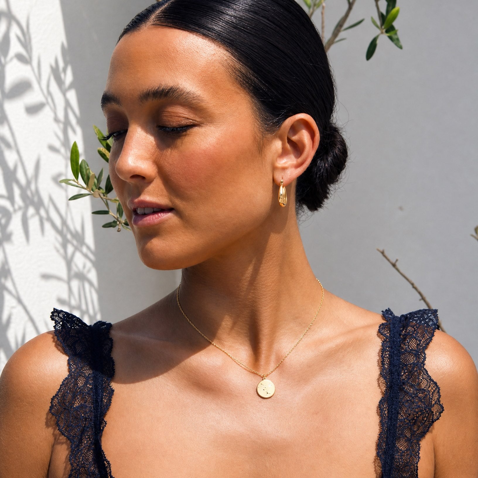 Lifestyle model wearing the Hunter Rose Luna 18k gold celestial coin necklace styled as everyday jewellery.