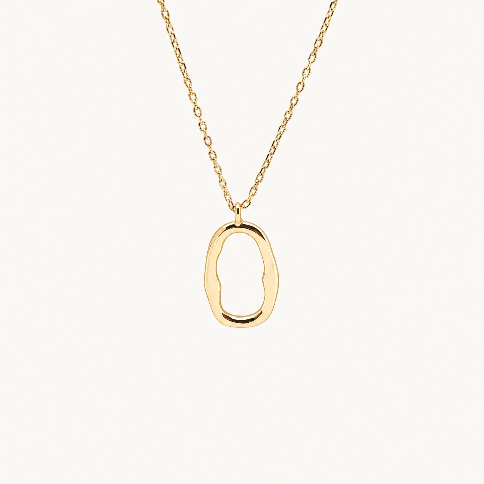 Studio view of the Hunter Rose Mae 18k gold plated sterling silver necklace featuring an organic open oval pendant.
