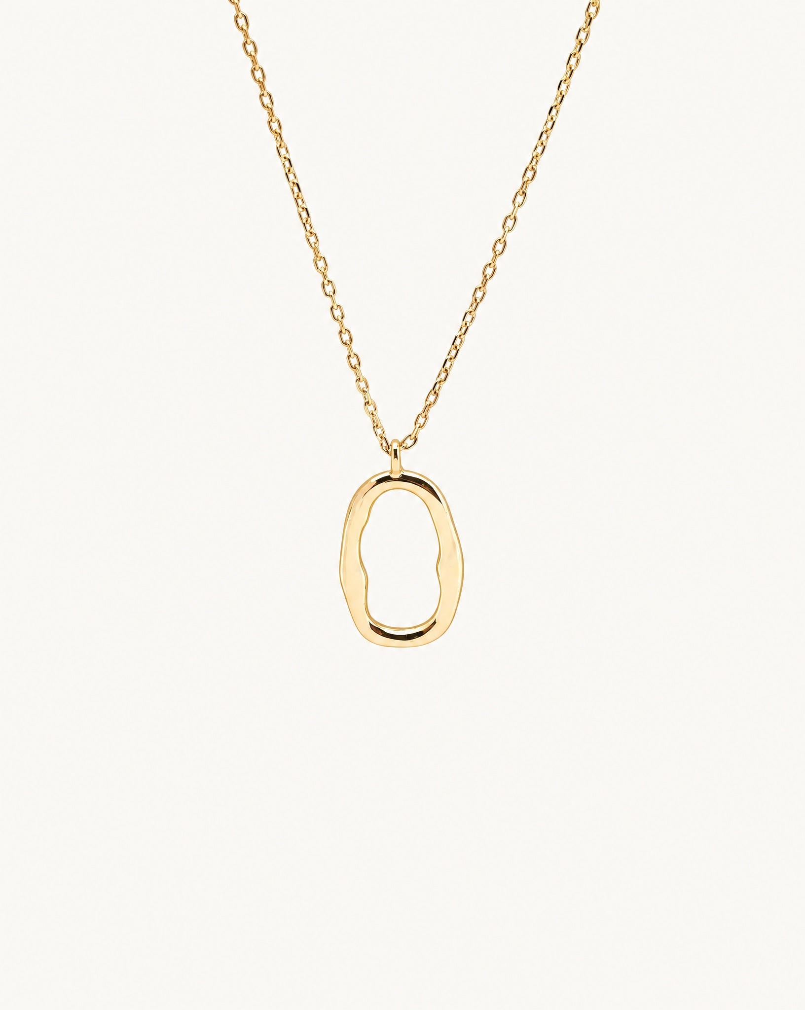 Studio view of the Hunter Rose Mae 18k gold plated sterling silver necklace featuring an organic open oval pendant.