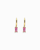 Gold  pendant hoop earrings with pink gemstones on a white background