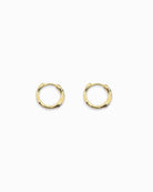 Jade huggie earrings flat lay on a white background