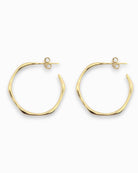 Large 18k Gold hoop earrings on a white background