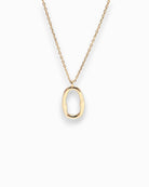 Gold necklace with a unique pendant on a white background