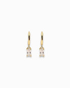 Gold pendant hoops earrings with clear gemstones on a white background