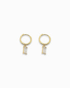 Gold pendant hoop earrings with clear  gemstones on a white background