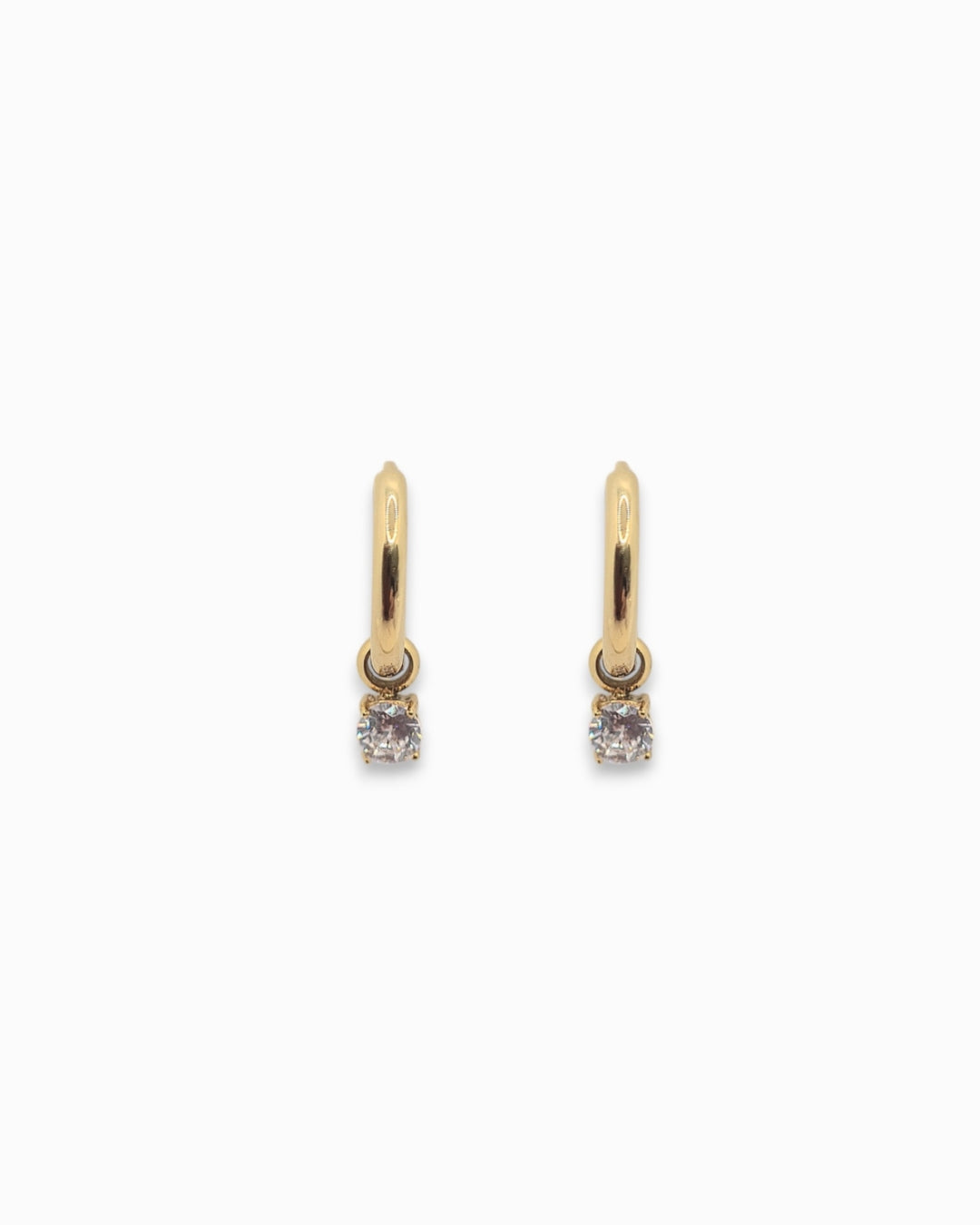 Gold pendant hoop earrings with small gemstones on a white background