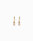 Gold pendant hoop earrings with coloured zirconia gemstones on a white background
