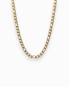 Gold Figaro chain necklace on a white background