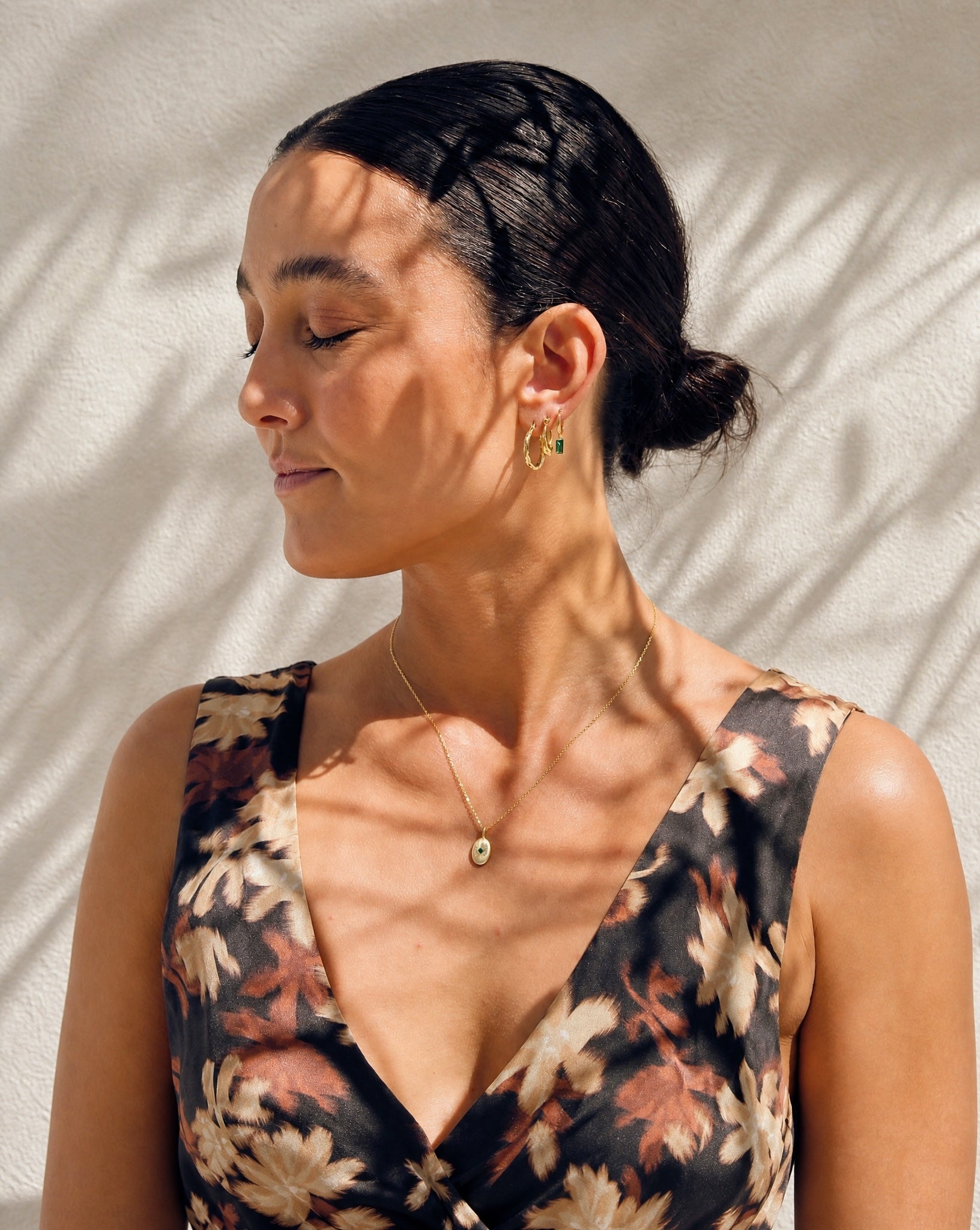 Model wearing the Hunter Rose Aura 18k gold plated hoop earrings