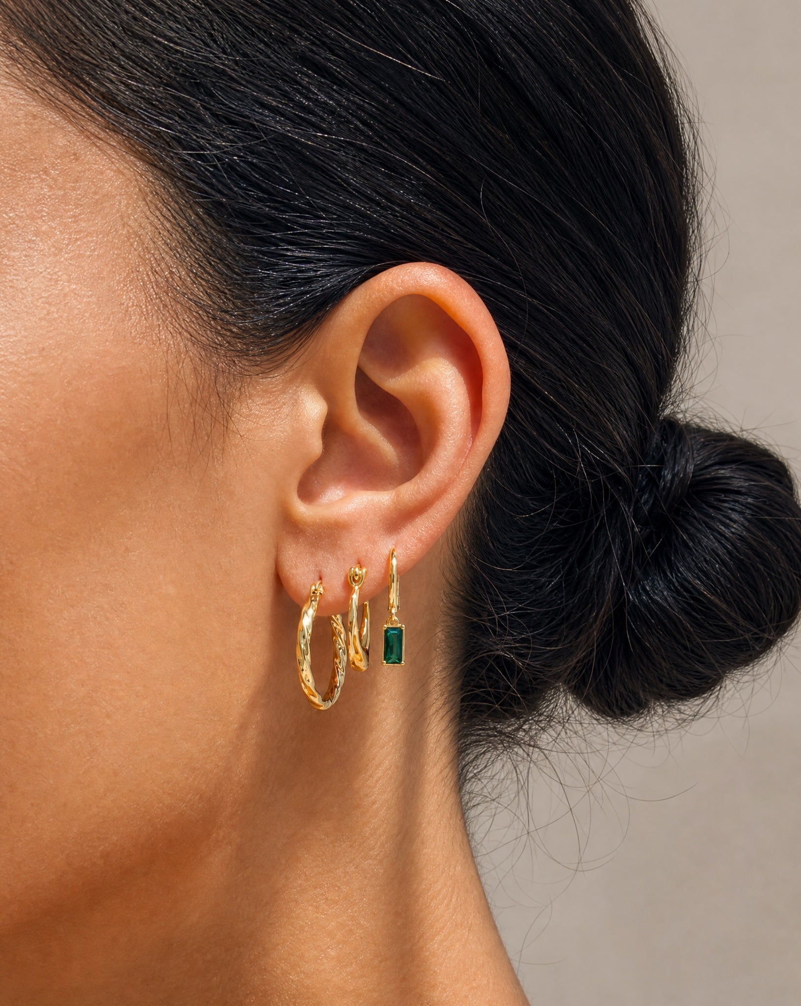 Close-up details of the Aura 18k gold plated sterling silver hoops by Hunter Rose.