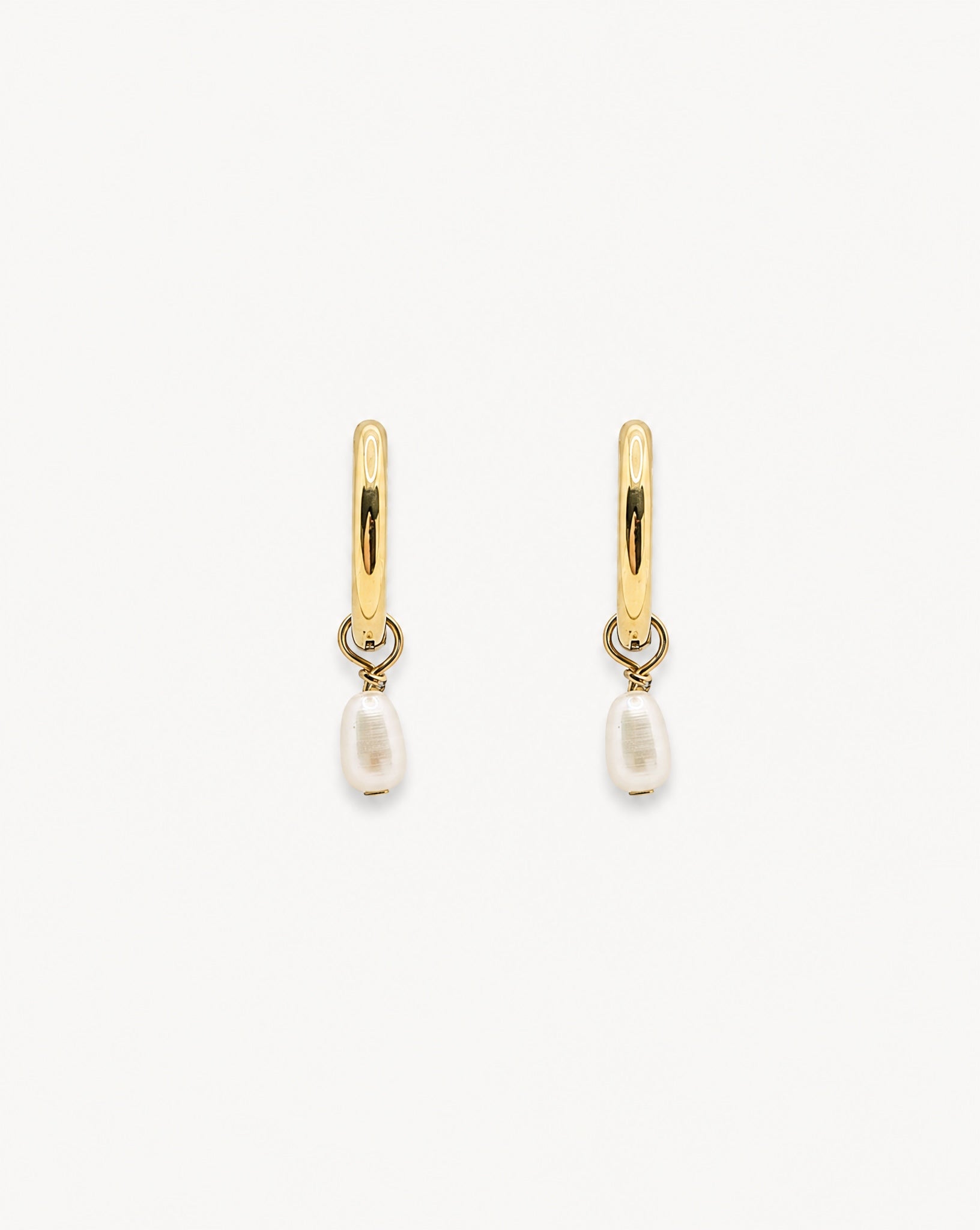 Alternative studio view of the tarnish-free Ayla gold pendant hoops by Hunter Rose.