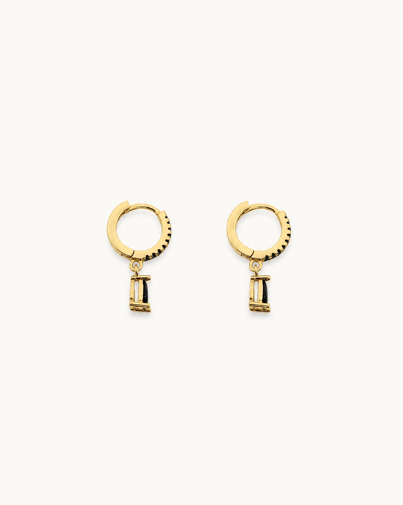Hunter Rose Bronte 18k gold plated huggie earrings featuring black zirconia pendants and a sterling silver base.