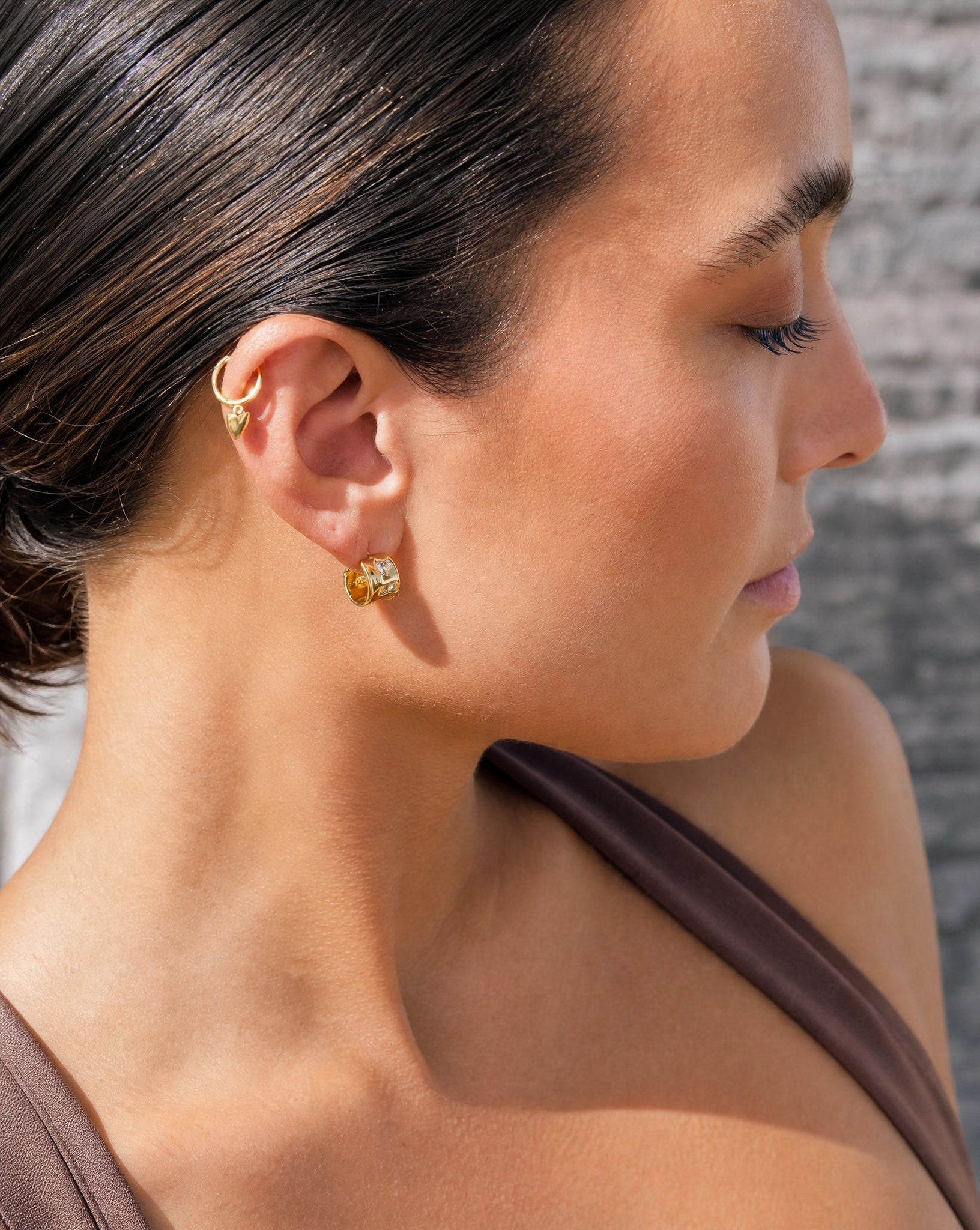 Pulled back lifestyle view showing the Hunter Rose Charlie gold plated hoops styled as everyday demi-fine jewellery.