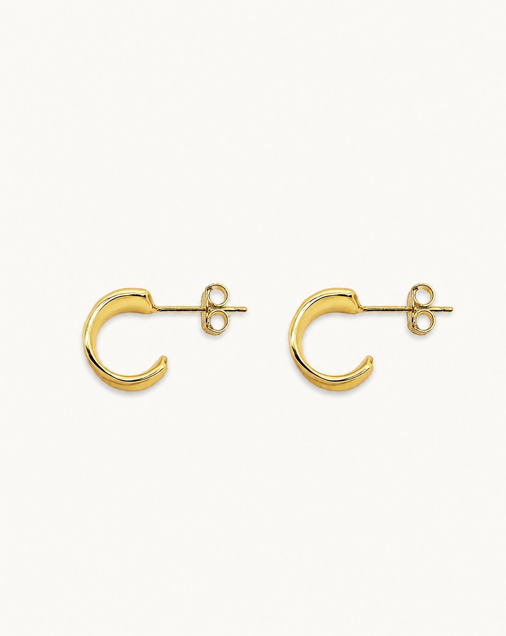 Angled view showing the open hoop design of the Charlie 18k gold plated sterling silver earrings by Hunter Rose.