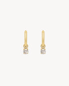 Studio view of the Hunter Rose Aria 18k gold waterproof pendant hoop earrings featuring a clear stone.