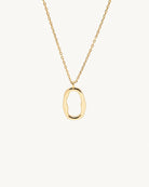Studio view of the Hunter Rose Mae 18k gold plated sterling silver necklace featuring an organic open oval pendant.