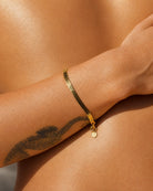 Styled product view of the demi-fine Serpentine 18k gold set by Hunter Rose.