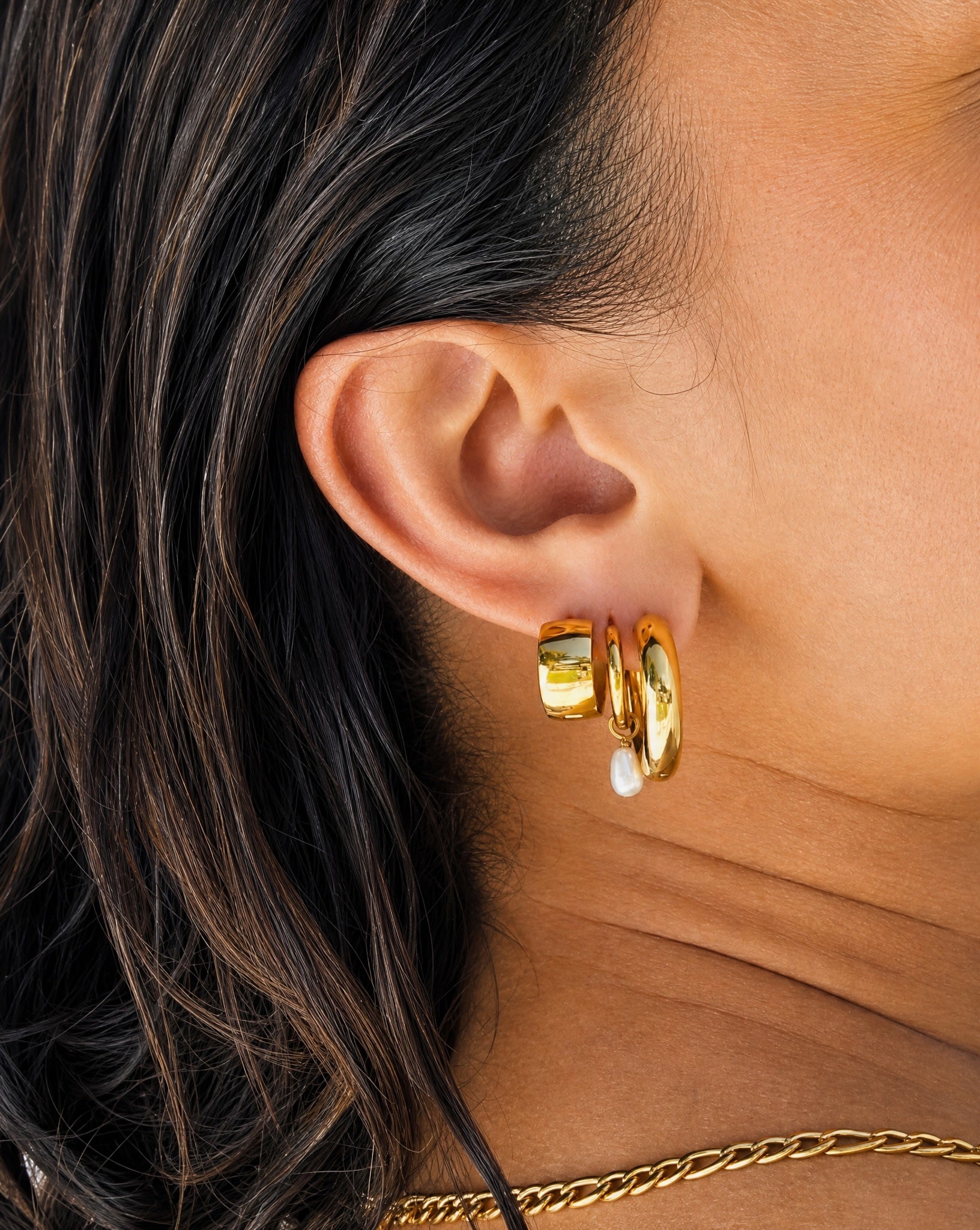Close-up detail of the tarnish-free Amelia gold hoops by Hunter Rose.